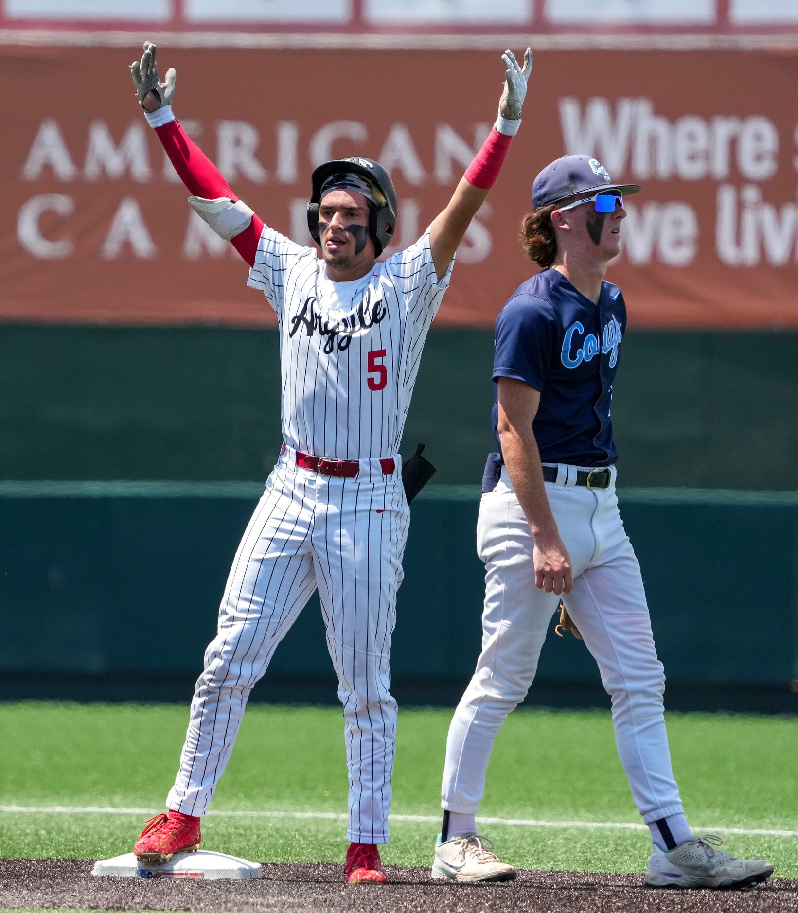 Argyle second baseman Colton Roquemore (5) celebrates as second base after reaching on a...