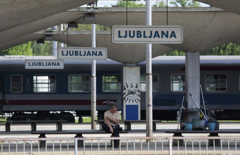 A passenger sits and waits on a platform at the main railway station in Ljubljana, Slovenia....