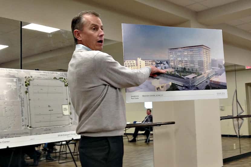 Here is Robert Dozier showing off his renderings Thursday night. Yes. That's Preston Center.
