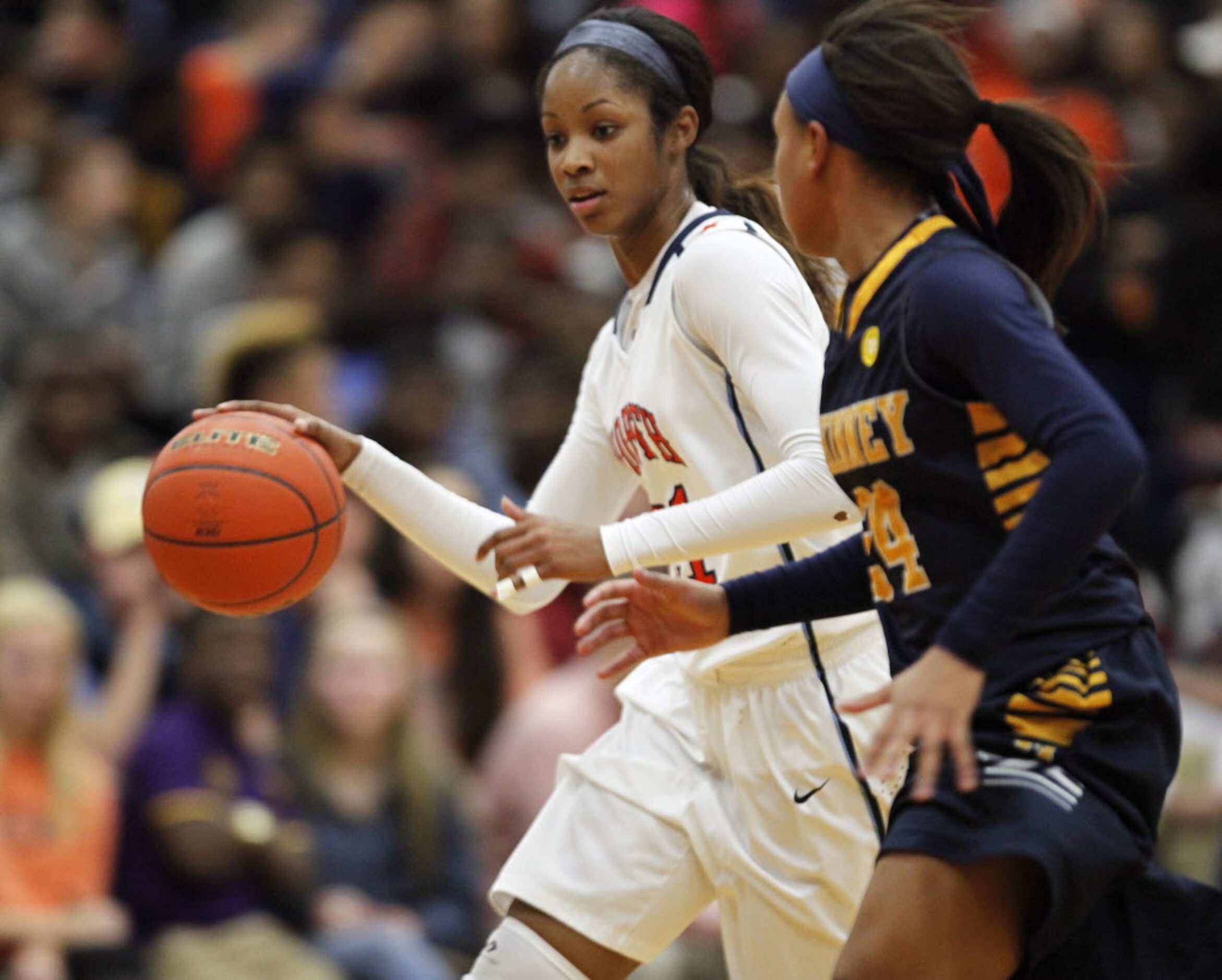 McKiney North guard Chanterria Jackson (21) dribbles as she is defended by McKinney guard ...