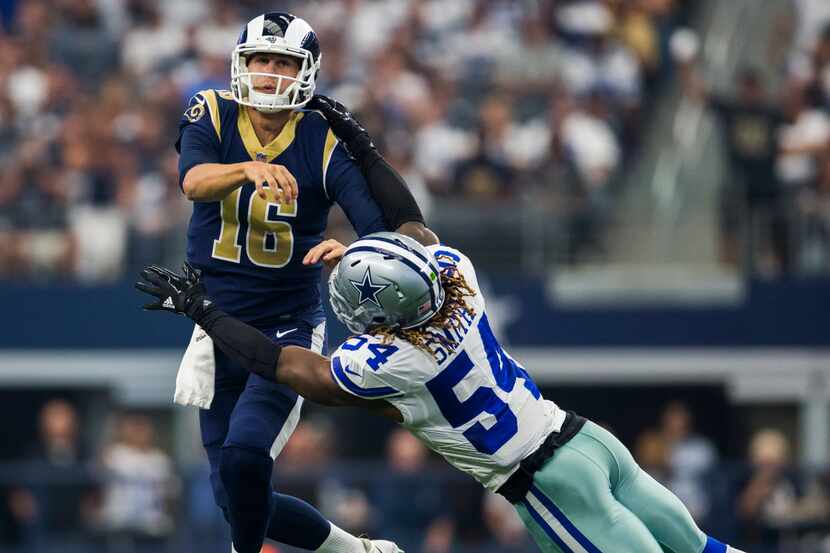 Dallas Cowboys outside linebacker Jaylon Smith (54) tackles Los Angeles Rams quarterback...