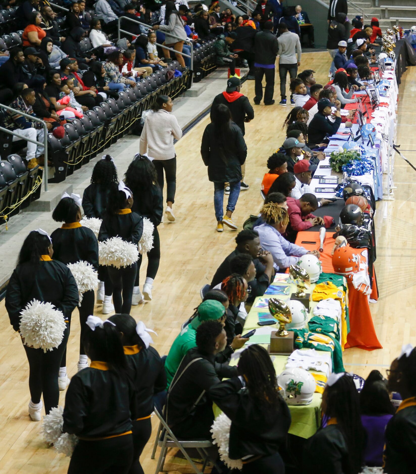 Players take their seats during a Dallas ISD signing day event at Ellis Davis Field House on...