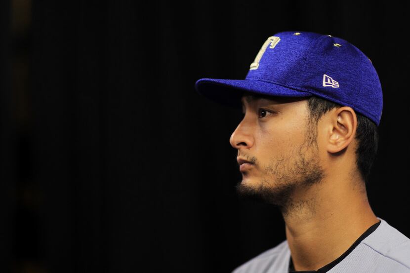 MIAMI, FL - JULY 10:  Yu Darvish #11 of the Texas Rangers and the American League speaks...