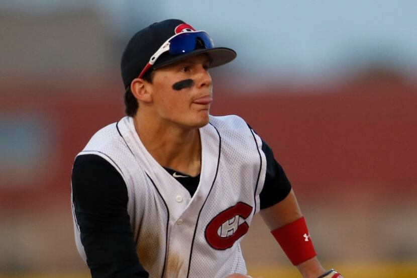 Colleyville Heritage shortstop Bobby Witt Jr. (17) reacts to the crack of the bat of a line...