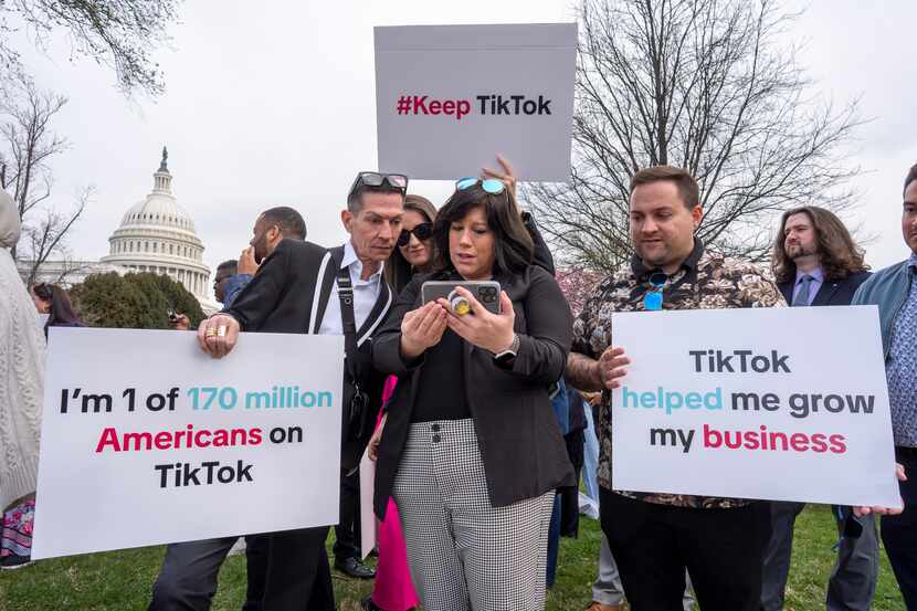 Devotees of TikTok monitor voting at the Capitol in Washington, as the House passed a bill...