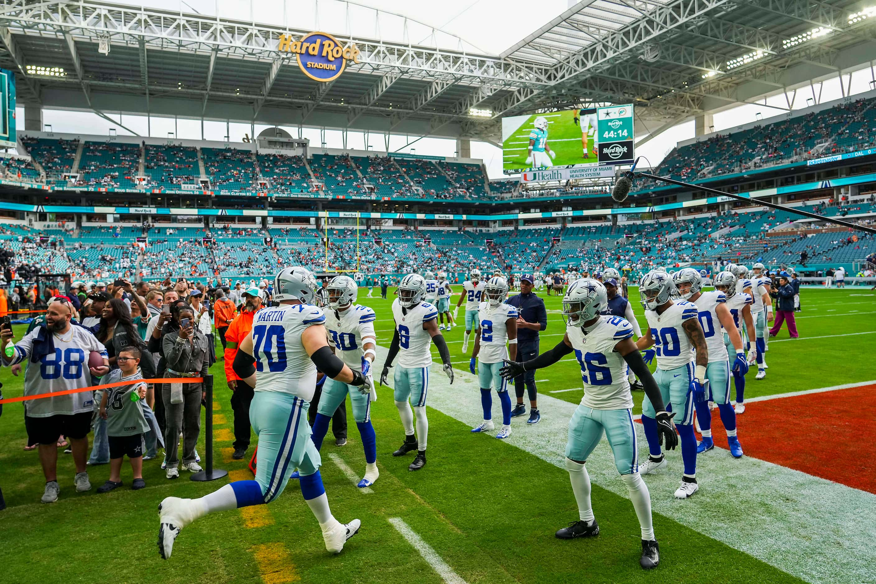 Dallas Cowboys guard Zack Martin (70) takes the field to warm up before an NFL football game...