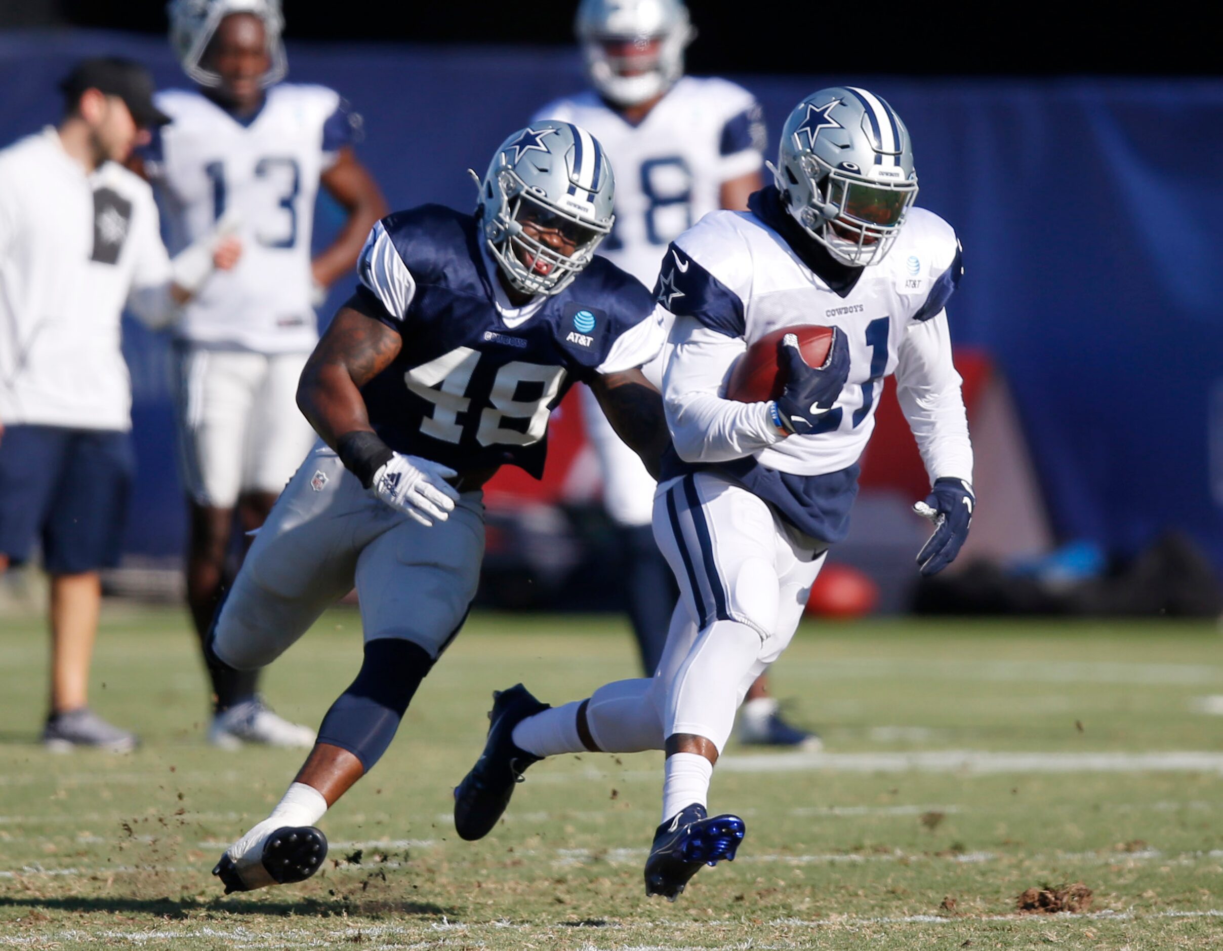 Dallas Cowboys running back Ezekiel Elliott (21) runs up the field as Dallas Cowboys...