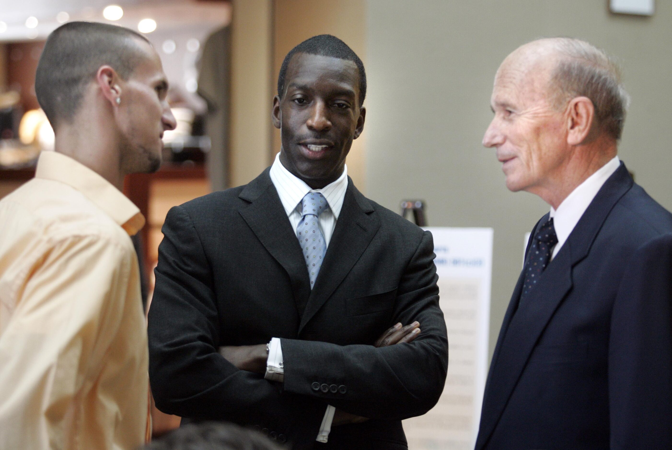 From left to right: Jeremy Wariner, Michael Johnson and Dr. Kenneth Cooper visit before a...