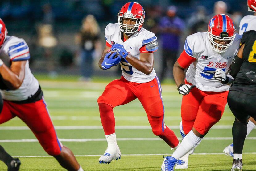 Duncanville senior running back Malachi Medlock (5) carries the ball during the first half...