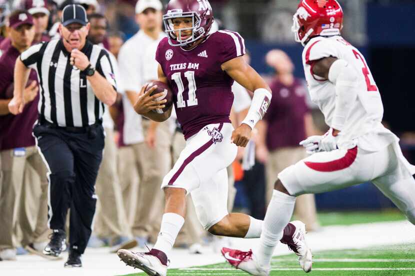 Texas A&M Aggies quarterback Kellen Mond (11) is run out of bounds by Arkansas Razorbacks...