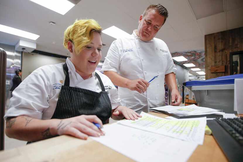 Banquet sous chef Krystal Berez, left, and executive banquet chef Brian Buttastalters review...
