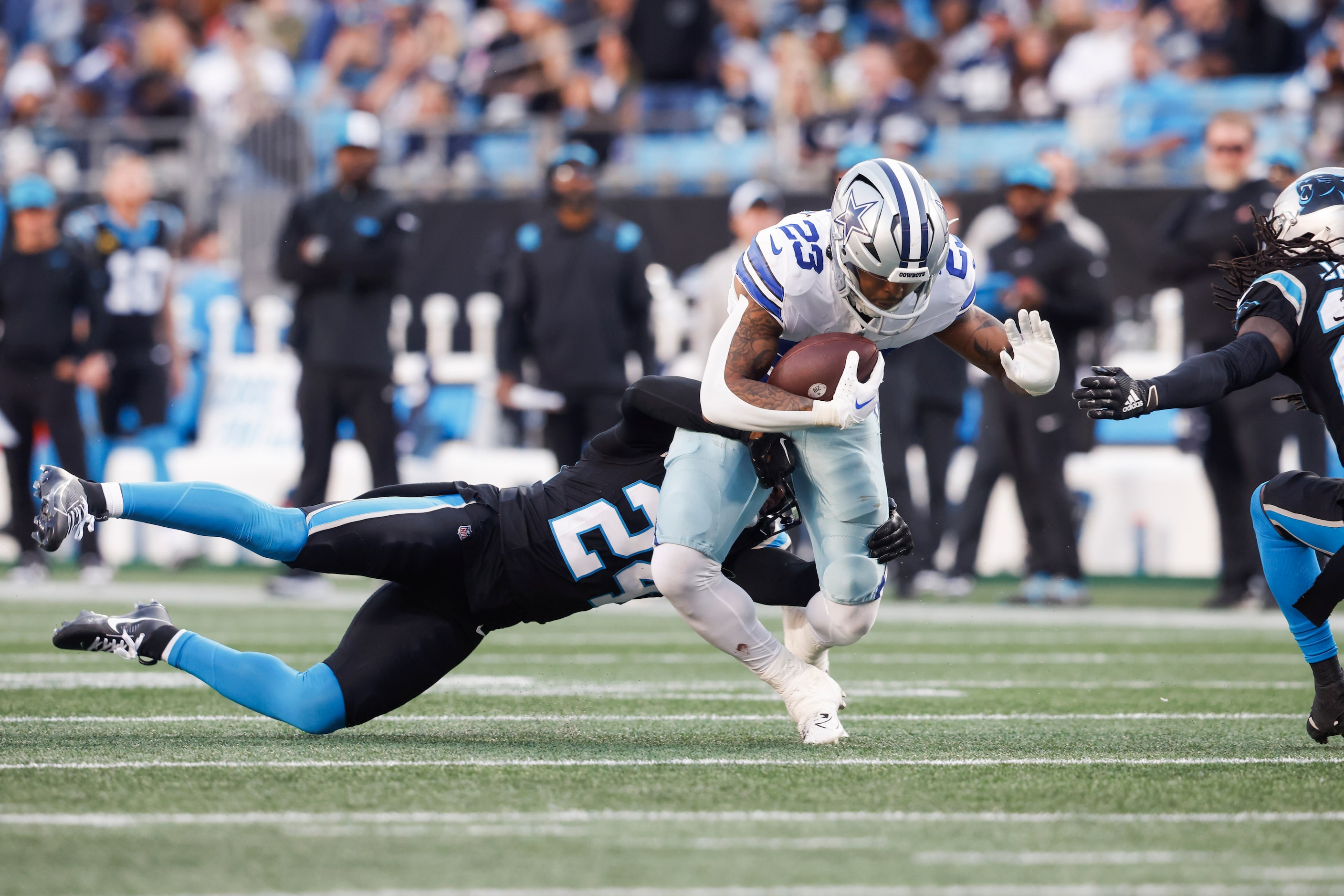 Carolina Panthers safety Vonn Bell (24) tackles Dallas Cowboys running back Rico Dowdle (23)...