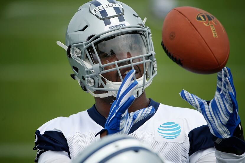 Dallas Cowboys running back Ezekiel Elliott (21) catches the ball on the field during...