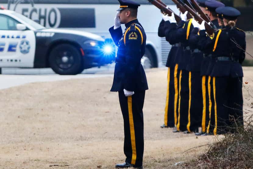 Dallas police officers fired a 21-gun salute for Richardson police Officer David Sherrard...