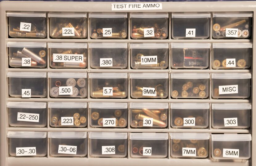 Test ammo in the room where guns found on crime scenes are tested using a machine that...