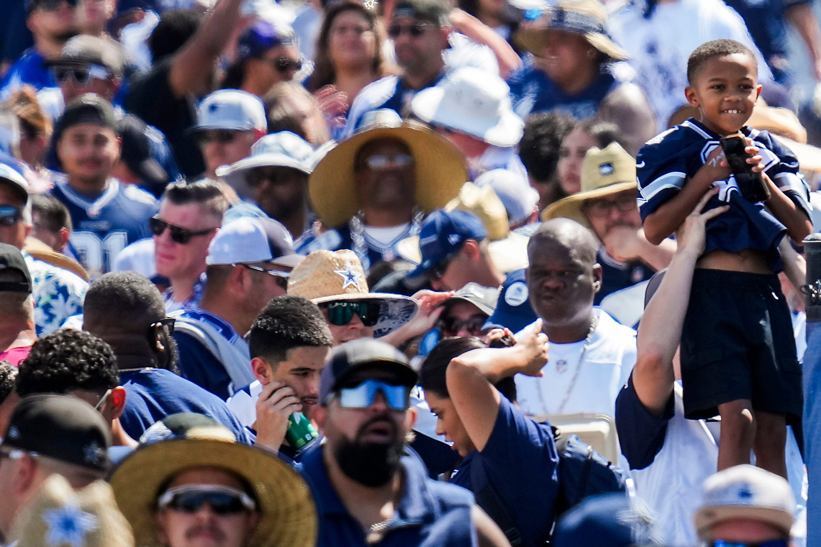 Fans wait for the gates to open  for the first practice of Dallas Cowboys training camp on...