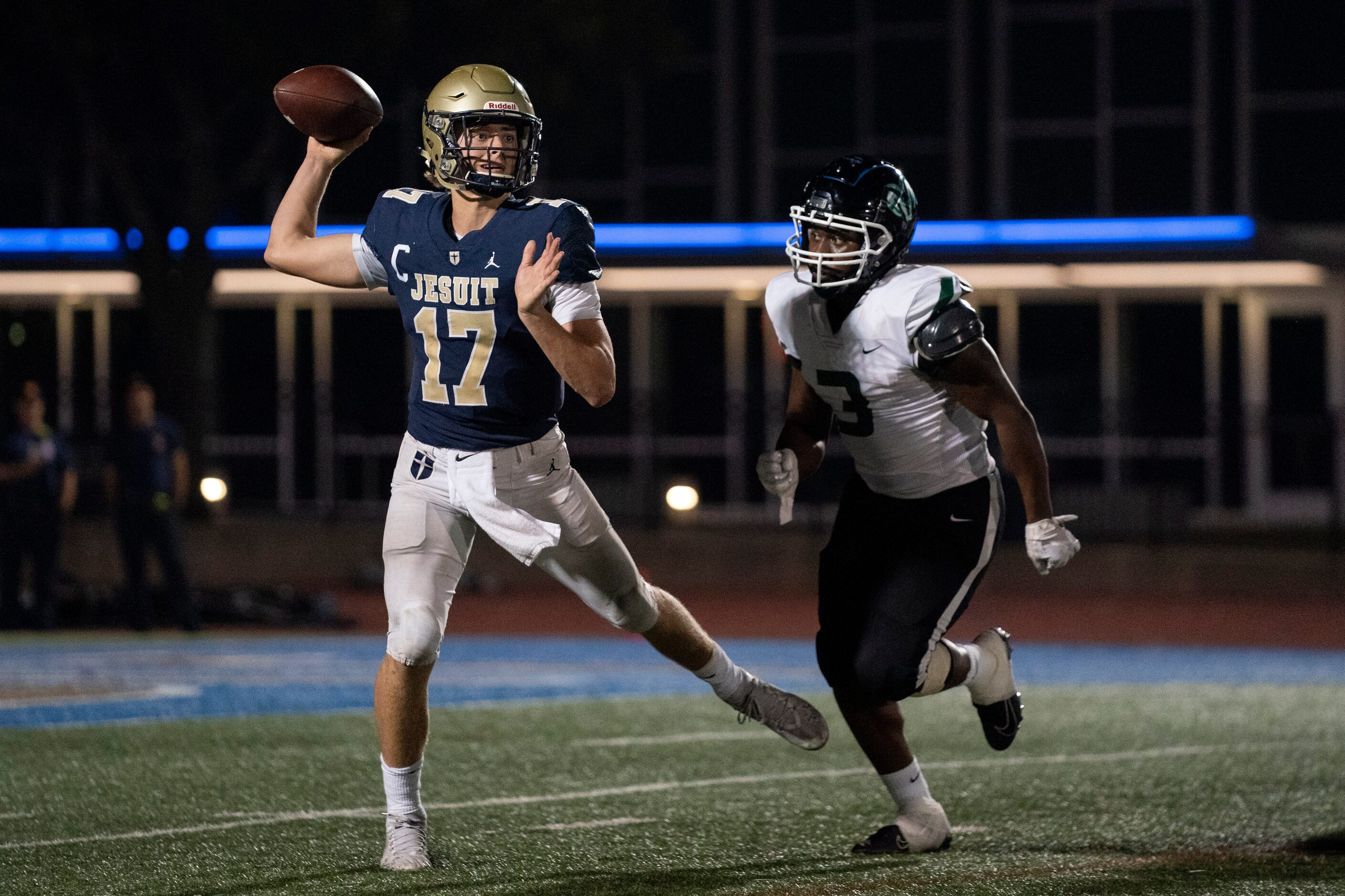 Jesuit senior quarterback Gage Roy (17) throws a pass as he scrambles away from Richardson...