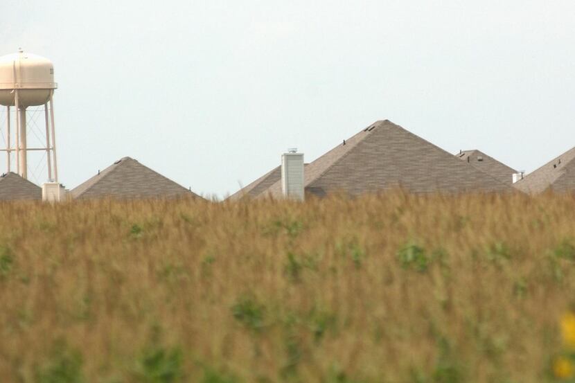 Looking like pyramids, these new rooftops rise high above a cornfield in Melissa. The...