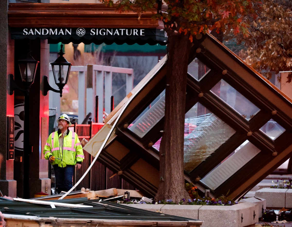 An Atmos Energy official takes readings at the site where an explosion occurred at the...