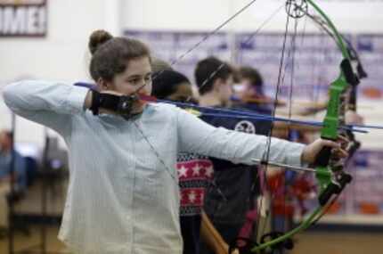  Caley Cekinobich shoots during archery practice at Allen ISD's Lowery Freshman Center....