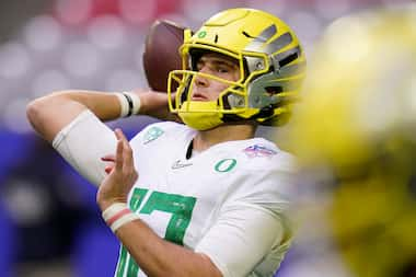 Oregon quarterback Tyler Shough (12) warms up prior to the Fiesta Bowl NCAA college football...