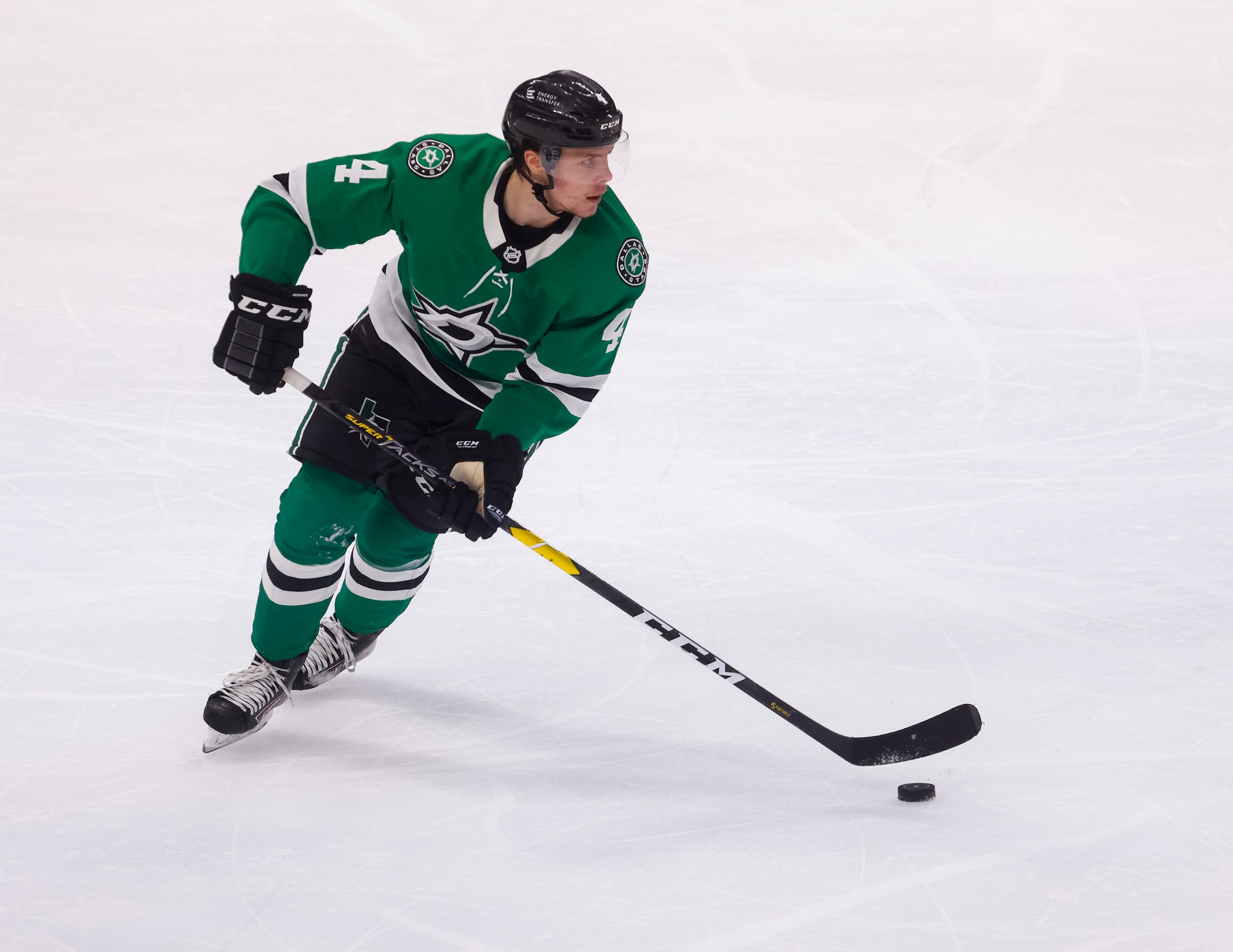 Dallas Stars defenseman Miro Heiskanen (4) guides the puck during the second period of a...