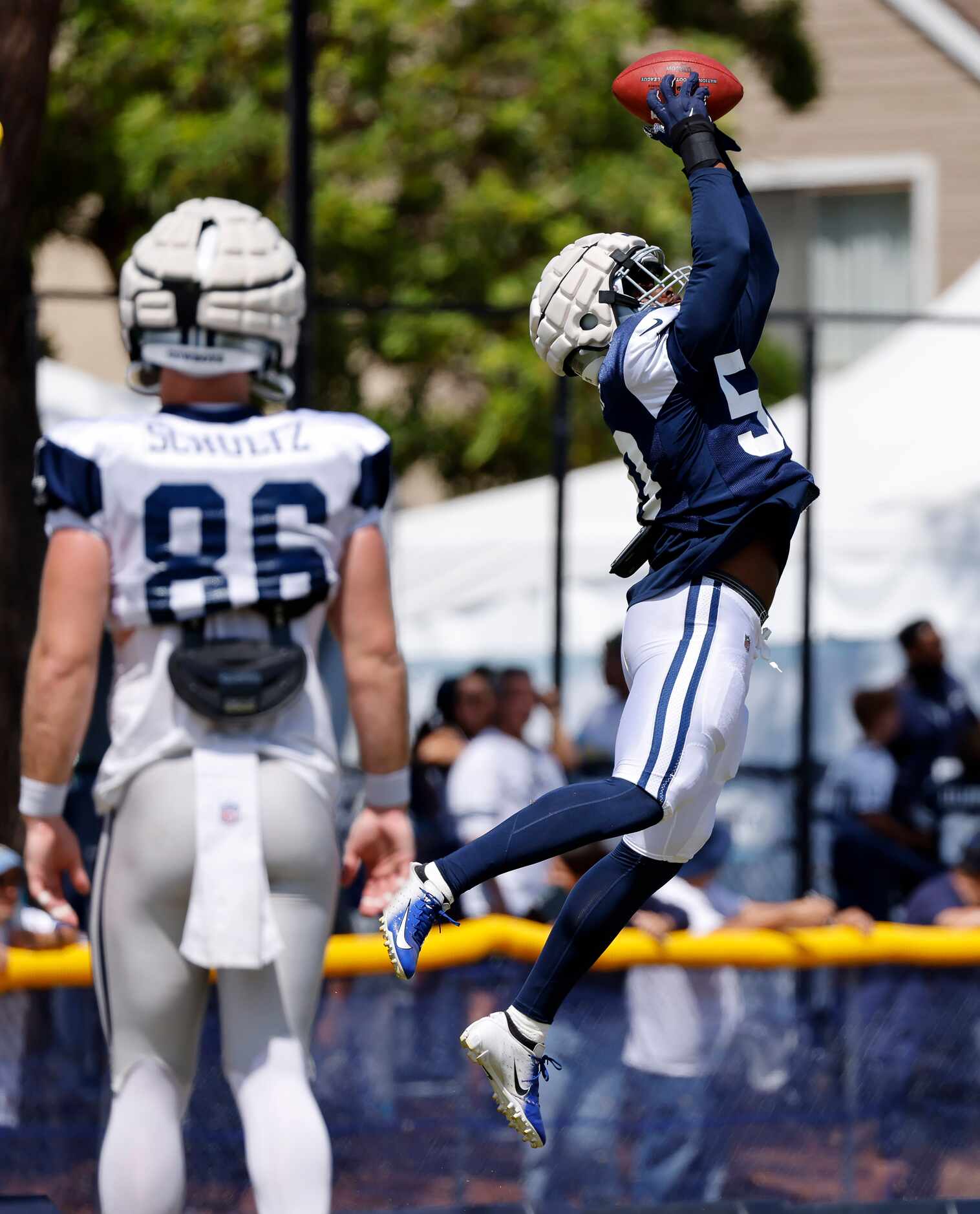 Dallas Cowboys linebacker Devin Harper (50) goes high for a the ball during a tipped pass...