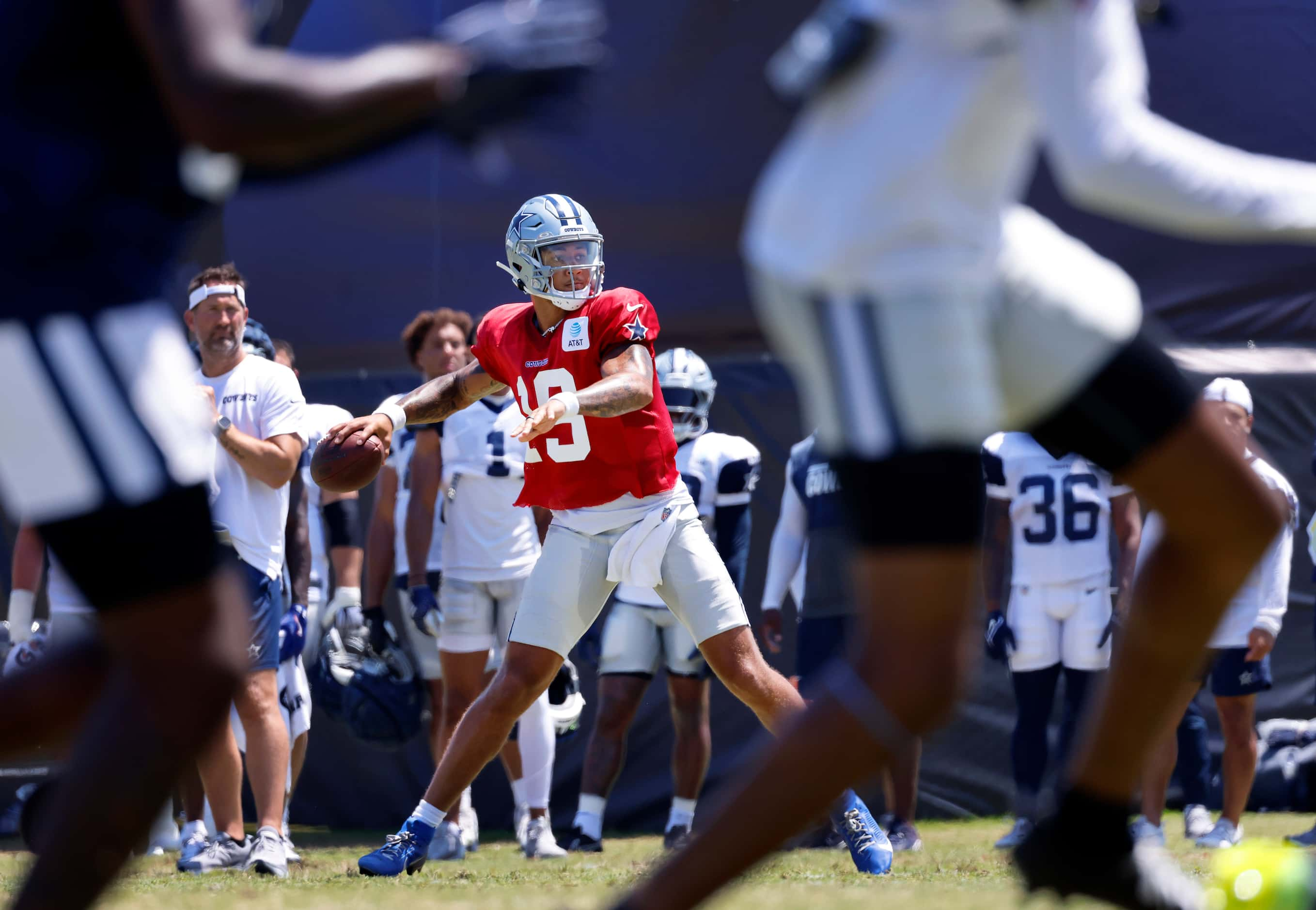 Dallas Cowboys quarterback Trey Lance (19) looks to throw deep as he rolls out against the...