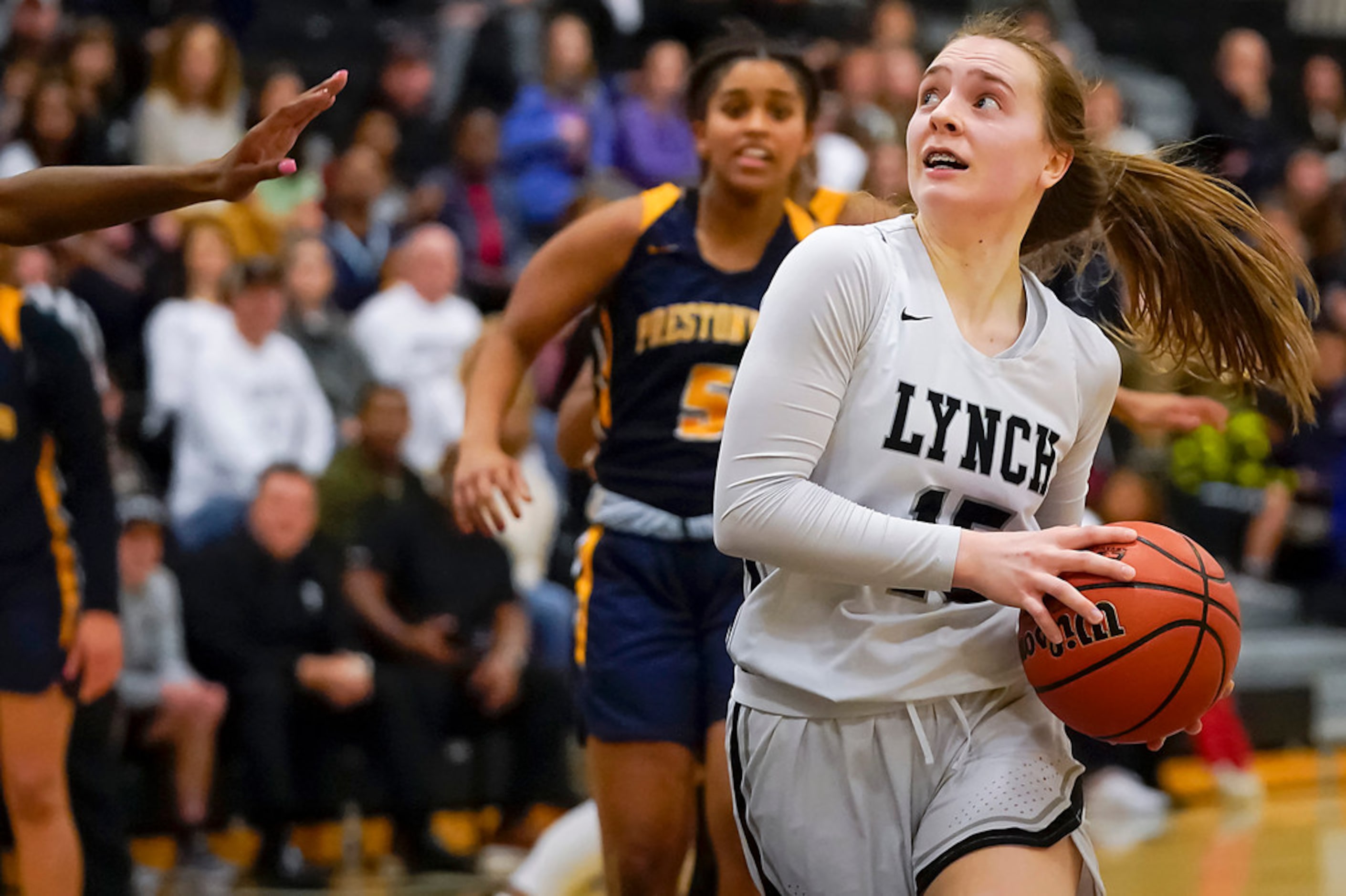 Bishop Lynch guard Paige Bradley (15) drives to the basket during a TAPPS 2-6A high school...