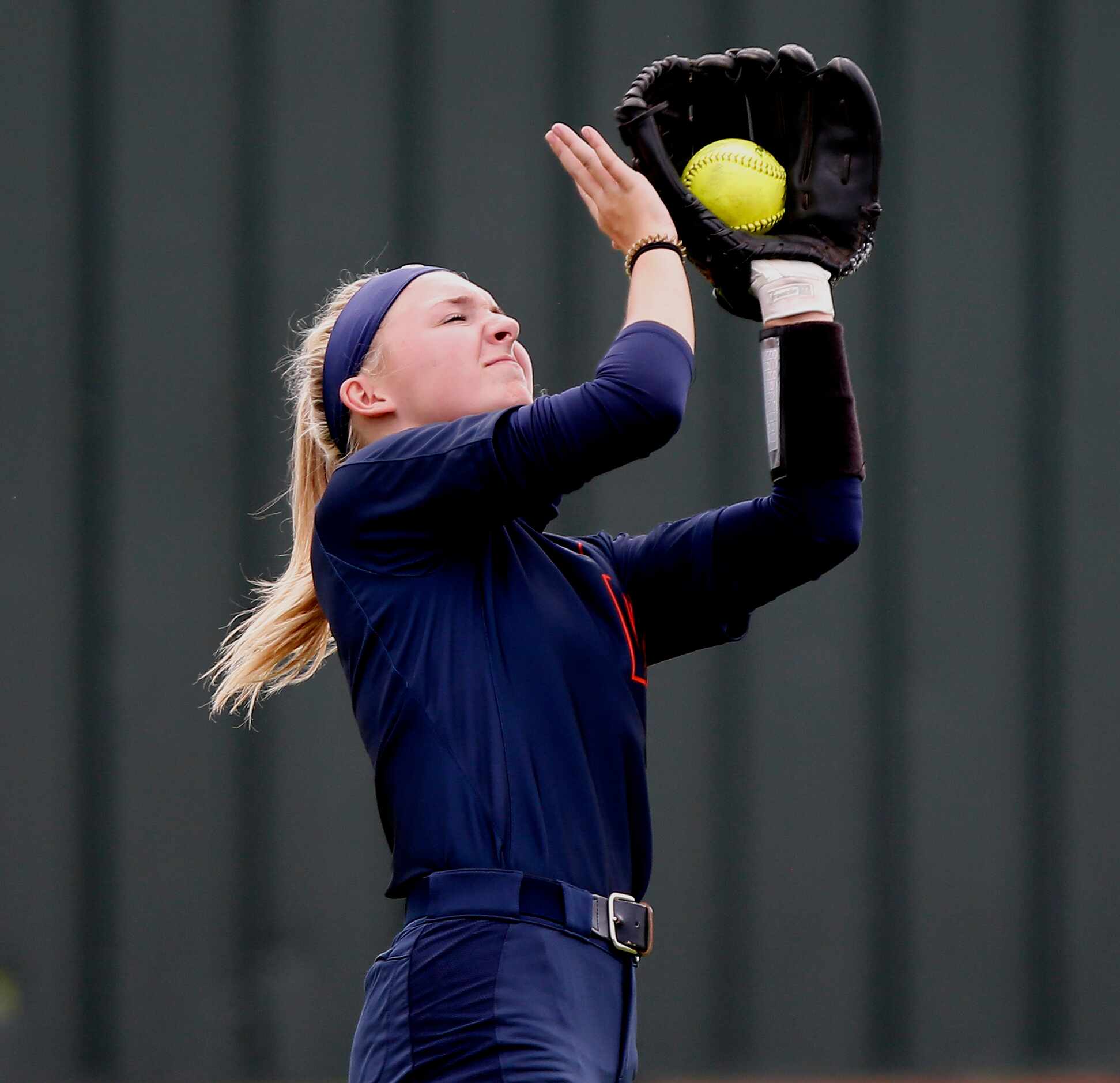 Wakeland center fielder Kate Ellis (6) makes the catch for an out in the sixth inning as...