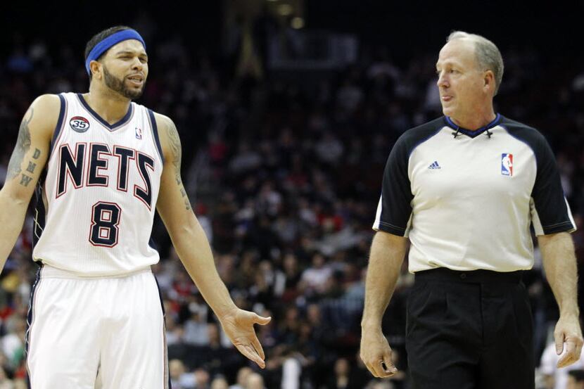 New Jersey Nets' Deron Williams (8) talks to referee Kevin Fehr during the third quarter of...