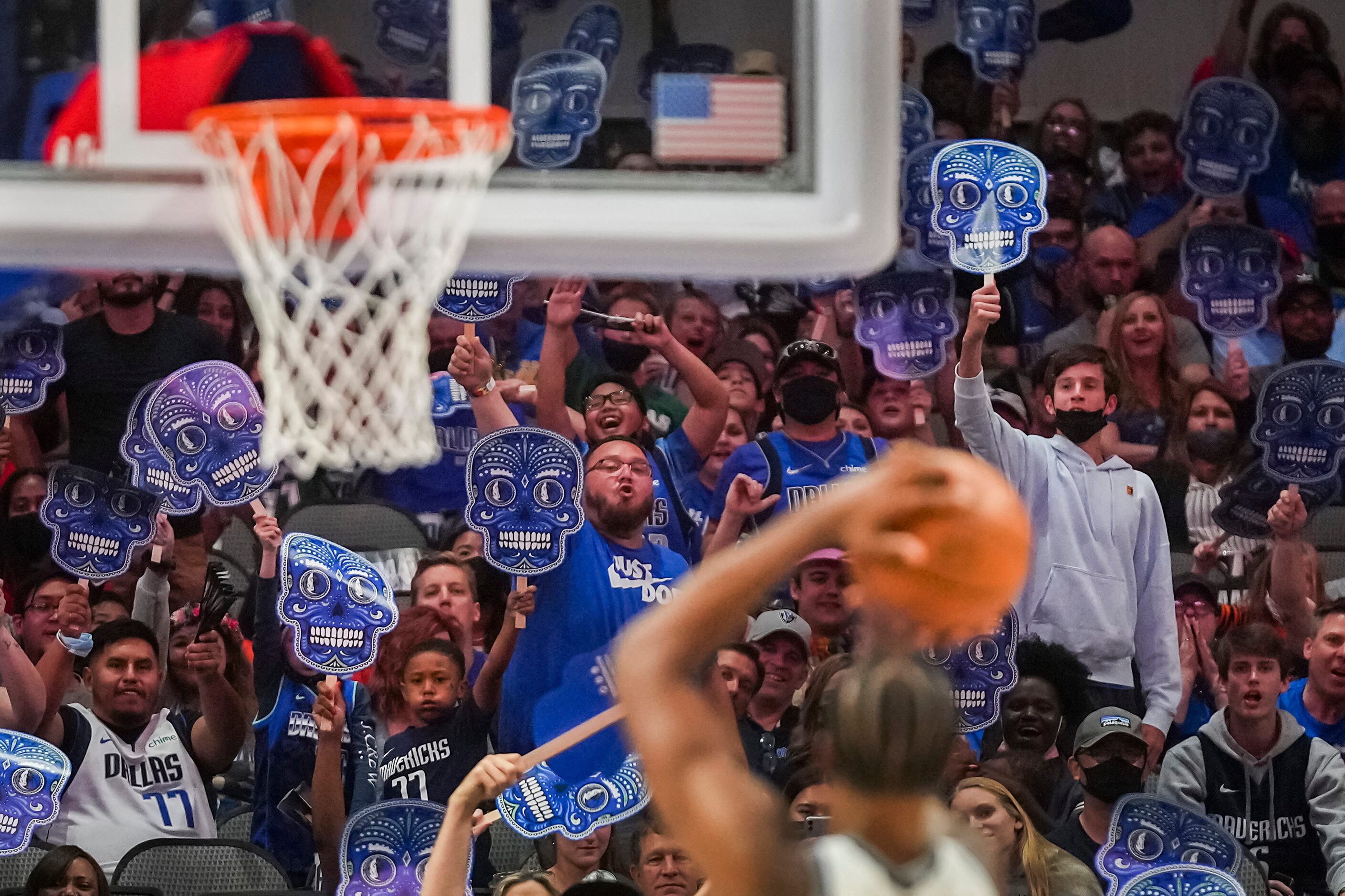 Dallas Mavericks fans try to distract a free throw by Sacramento Kings center Tristan...