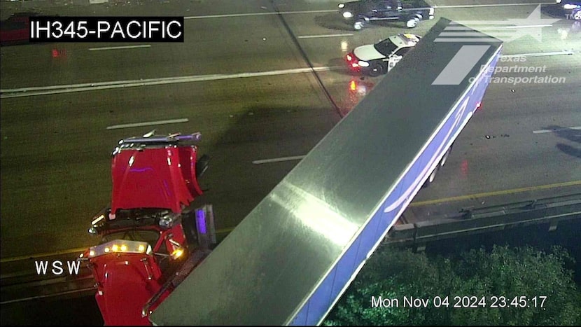 An 18-wheeler was partially hanging from a bridge near I-45 and I-345 in Dallas County on...