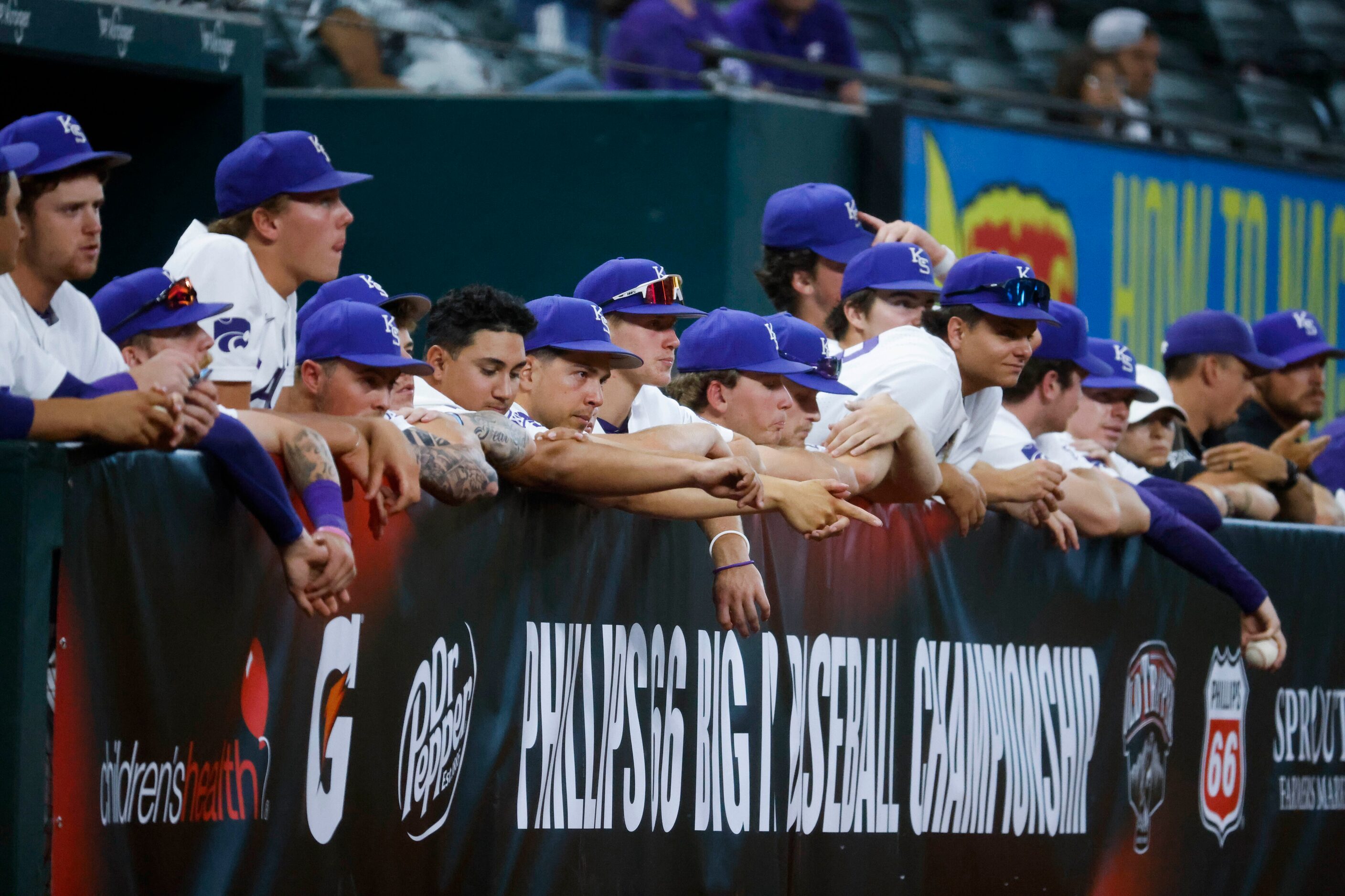 Kansas St. players watch a baseball game against Kansas at Globe Life Field on Friday, May...