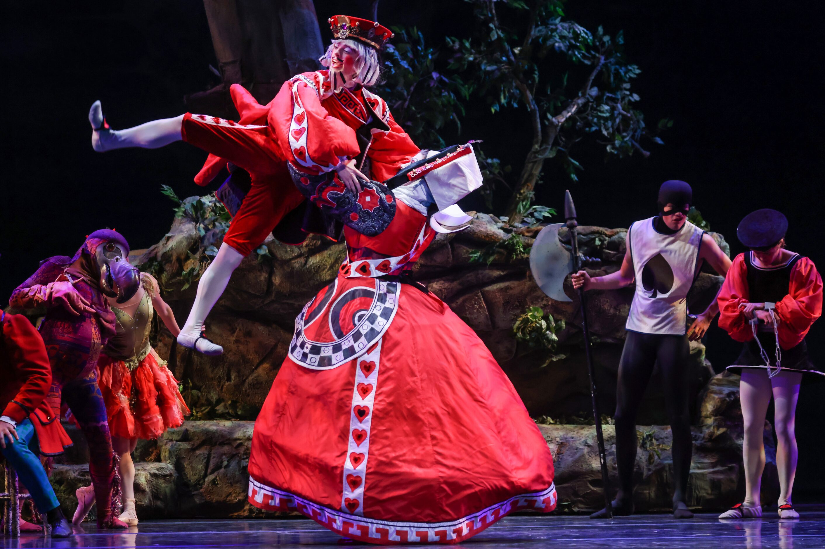 The King (Jason McClung, left) and Queen of Hearts (Jackson Bayhi) dance in front of their...