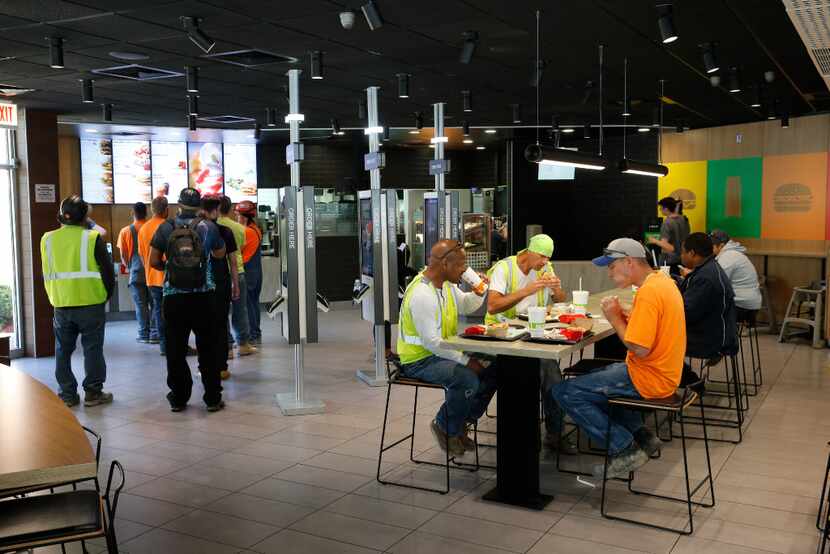 Customers eat in a remodeled dining room at a McDonald's restaurant in Chicago. (AP/Charles...