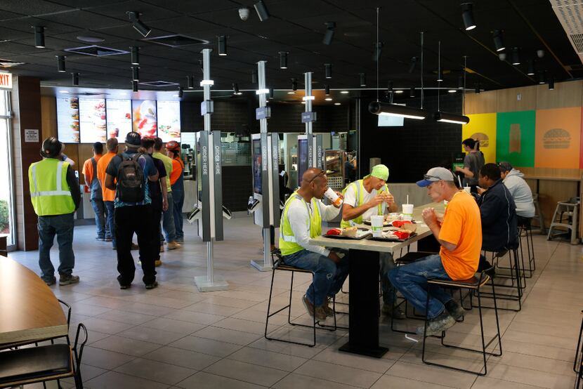 Customers eat in a remodeled dining room at a McDonald's restaurant in Chicago. (AP/Charles...