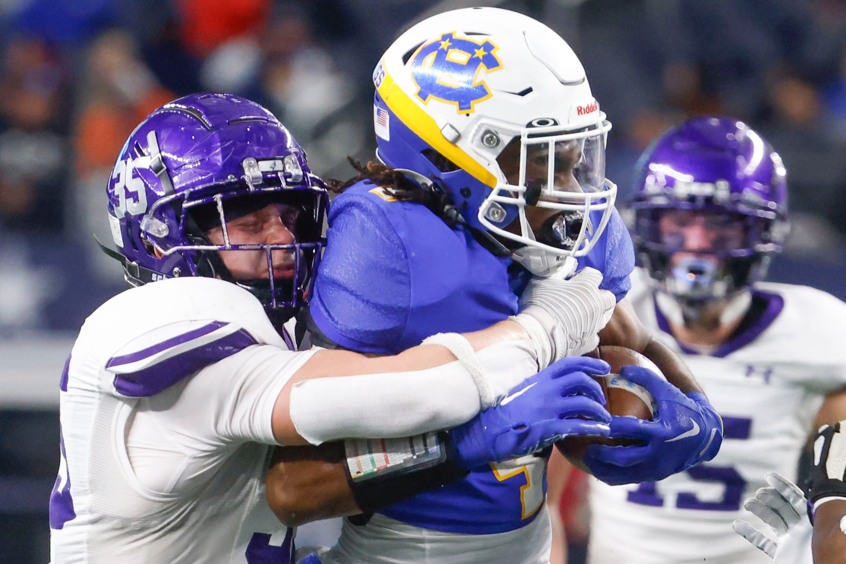 Anna High’s Cj Miller (left) tackles Tyler Chapel Hill’s Rickey Stewart before bringing him...