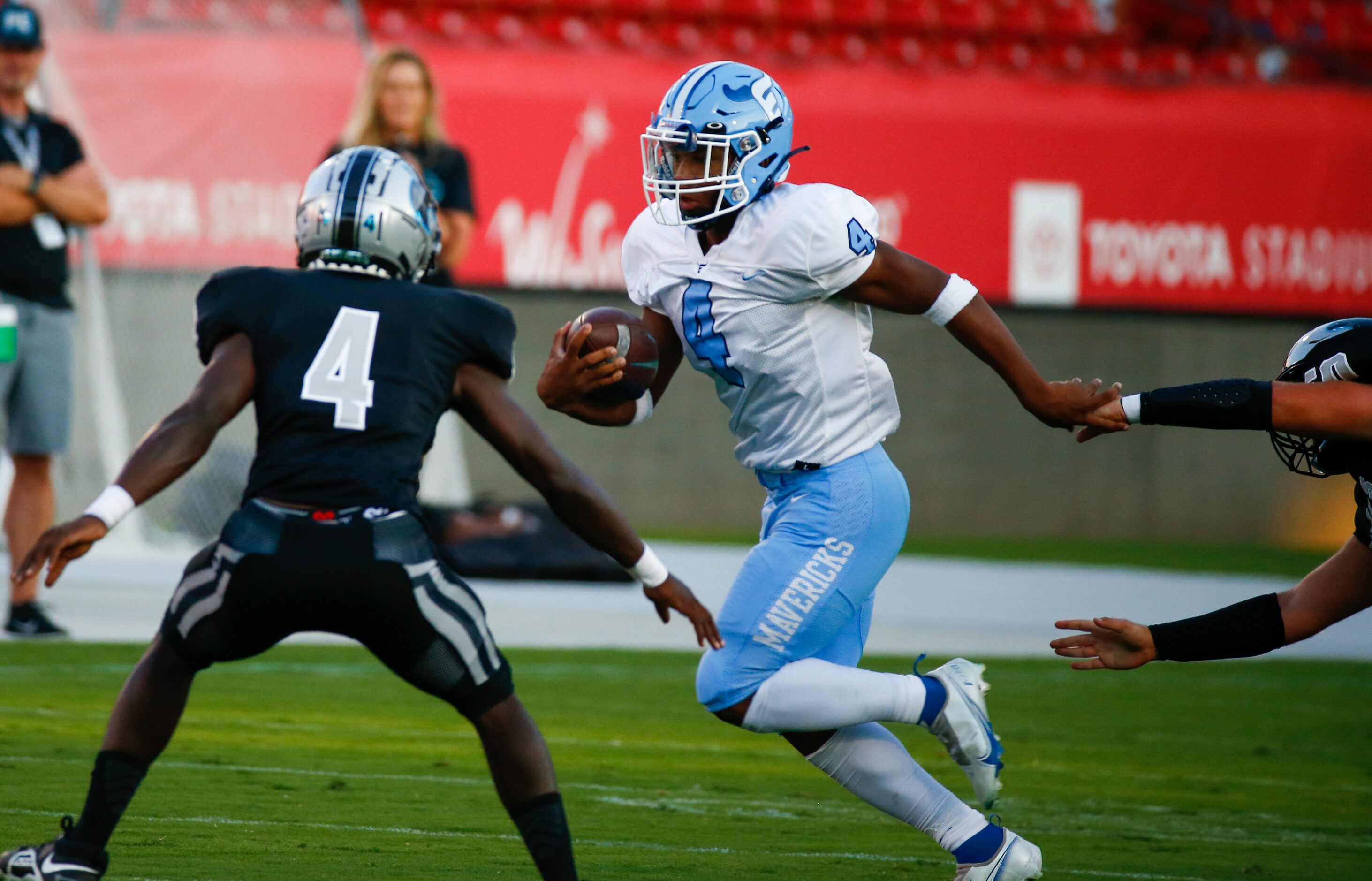 Emerson Mavericks running back Kameron Lockhart (4) dodges Panther Creek Panthers defense...