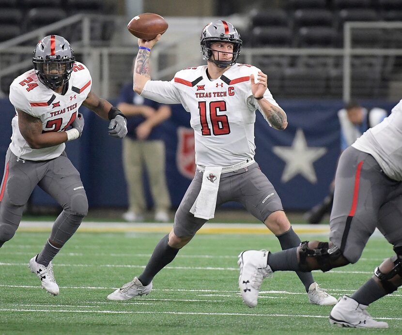 Texas Tech Red Raiders quarterback Nic Shimonek (16) drops back to pass during the first...