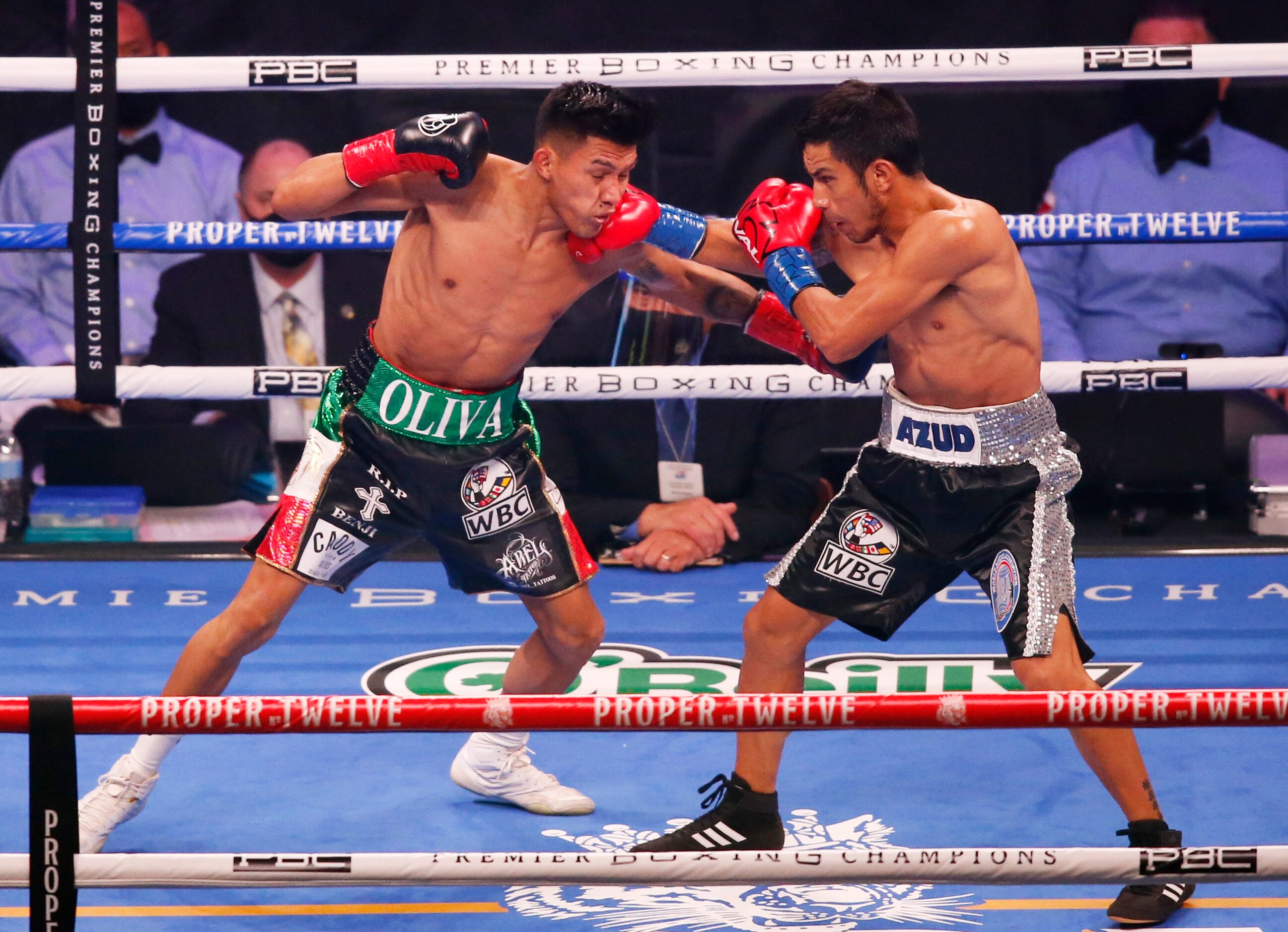 Miguel Flores is hit by Eduardo Ramirez during the first round at AT&T Stadium on Saturday,...