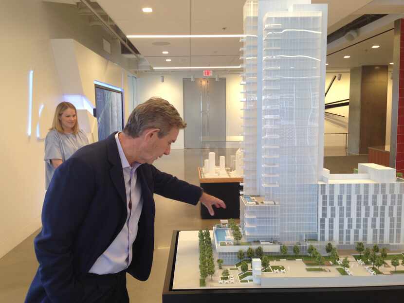 Developer Craig Hall explains a model of his Hall Arts Residences and Hotel project in...