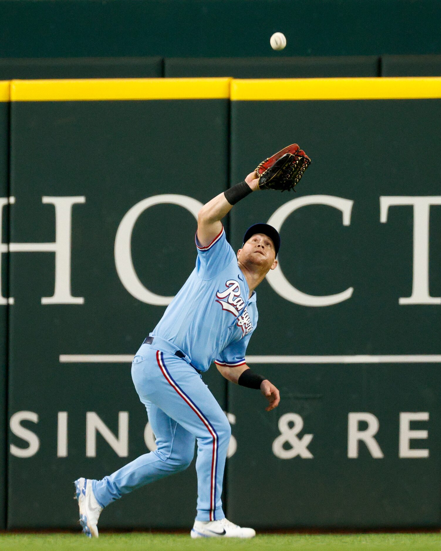 Texas Rangers right fielder Kole Calhoun (56) catches a fly ball during the seventh inning...