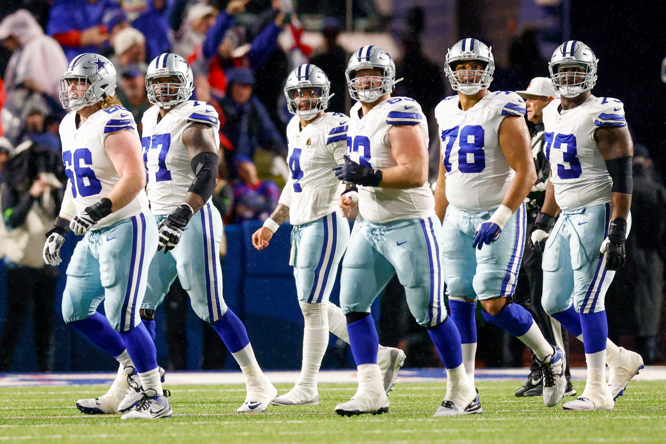 Dallas Cowboys quarterback Dak Prescott (4) and the Cowboys offense walk off the field after...