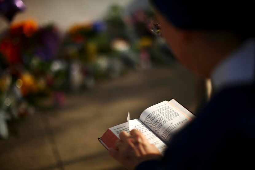 
People pray outside the Emanuel African Methodist Episcopal Church. 
