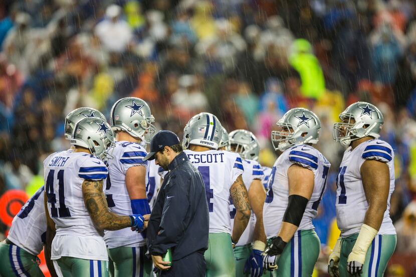Rain falls on the Dallas Cowboys during the third quarter of an NFL game between the Dallas...