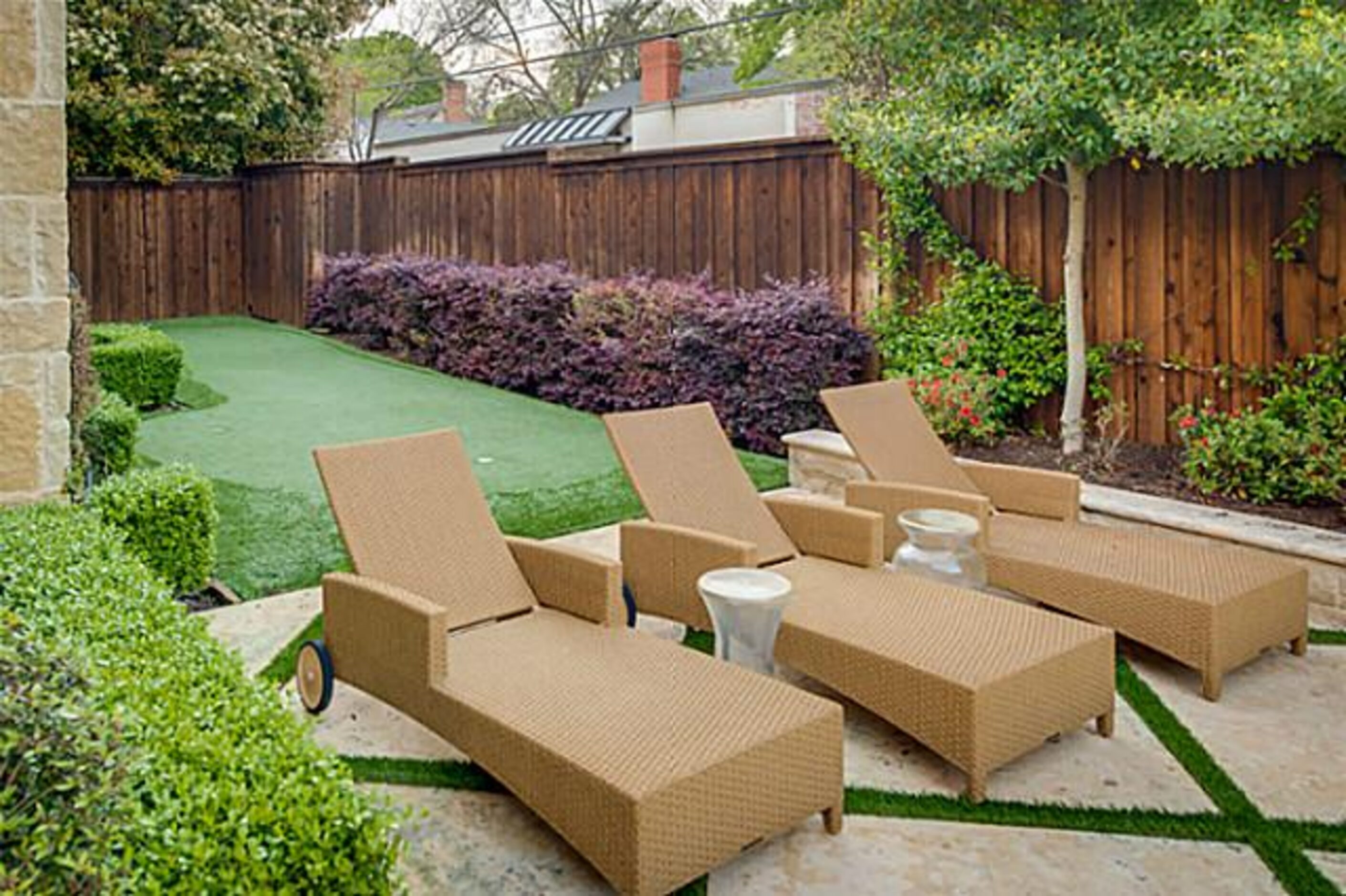 The outdoor environment room has grilling necessities and a fireplace.