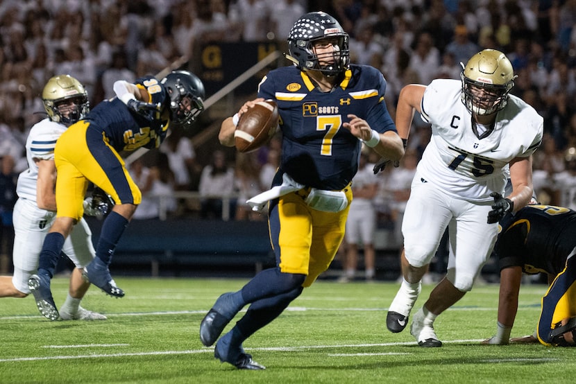 Highland Park senior quarterback Brennan Storer (7) runs for a big gain in yardage ahead of...