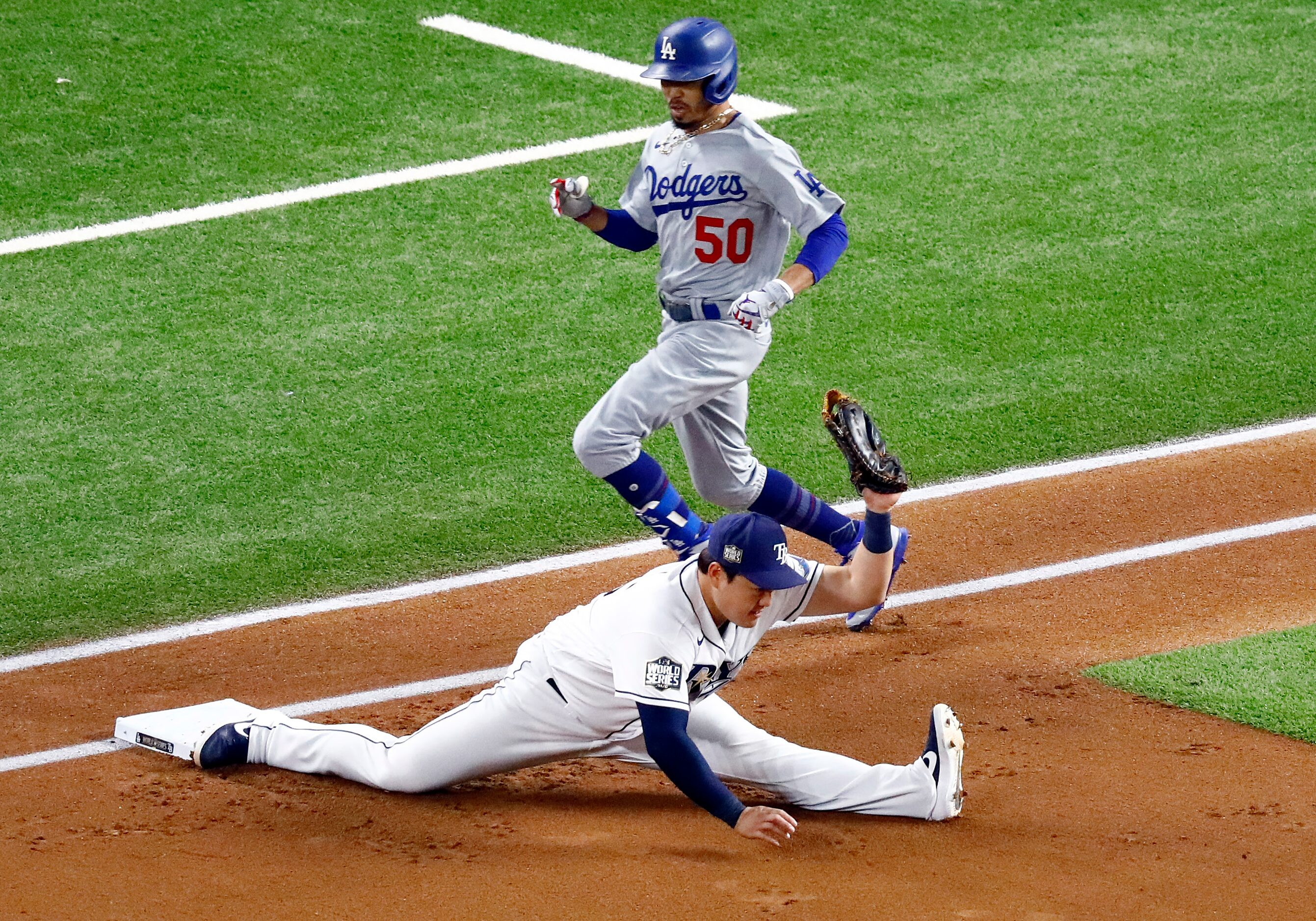 Tampa Bay Rays first baseman Ji-Man Choi (26) does the spilts to get Los Angeles Dodgers...