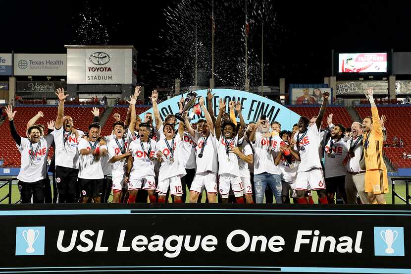 North Texas SC hoists the 1st ever USL League One Final trophy at Toyota Stadium, October...